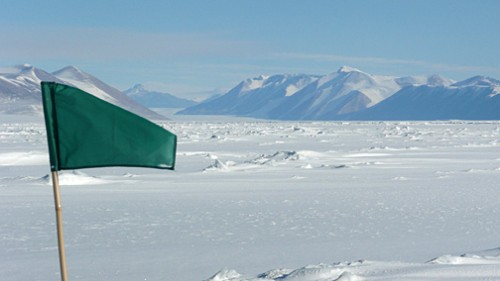 A marker flag in the area where the Offshore New Harbor (ONH) Project researchers are working. Ferrar Valley is visible in the background.